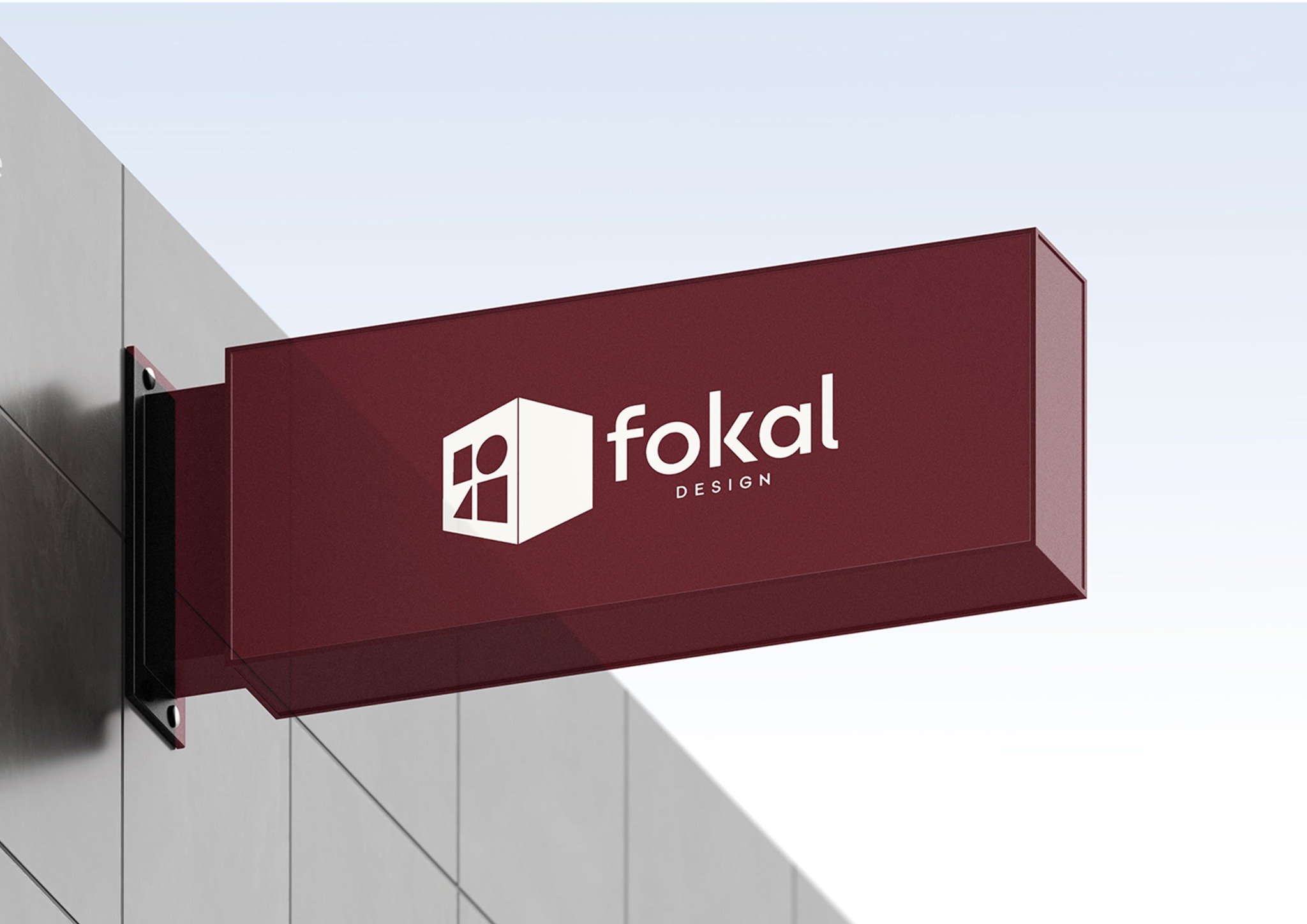 Fokal Design identity on a deep red architectural exterior sign